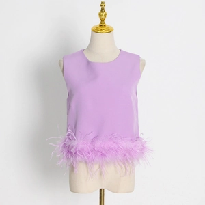 Detailed view of lavender sleeveless top featuring soft ostrich feather trim at the hemline