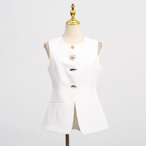 Detail of white sleeveless vest featuring unique sun-shaped gold buttons and flap pockets