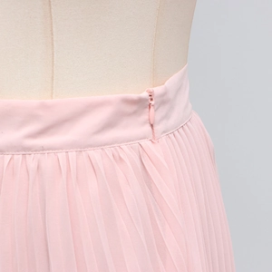 Detail of light pink pleated skirt featuring a seamless side invisible zipper closure