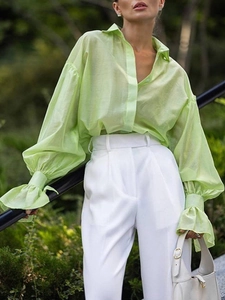 Elegant women's light green lantern sleeve blouse and white wide-leg pants outfit