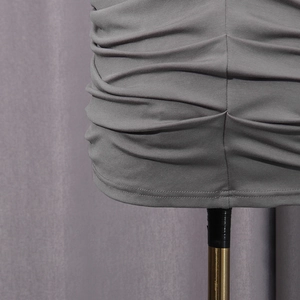 Macro shot of dark grey pleated fabric detail with high-elasticity knitted texture