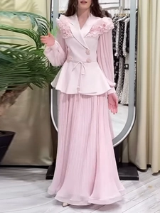 Elegant pink summer set for women featuring ruffled long-sleeve top and pleated maxi skirt