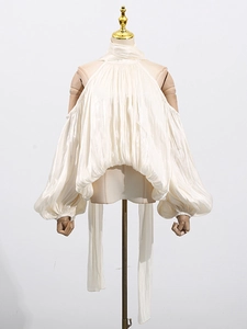 Elegant off-shoulder halter neck blouse in cream silk with puff sleeves and long sashes