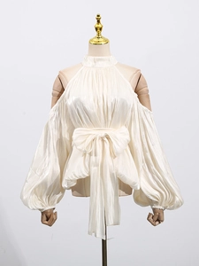 Elegant off-shoulder halter neck blouse in pleated cream satin with large waist bow