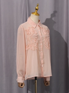 Elegant light pink long sleeve blouse with ruffled lace texture and button-up front design