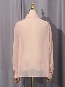 Back view of elegant light pink long sleeve chiffon blouse with classic collar for women
