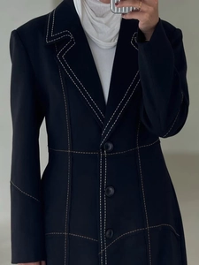 Slim-fit long black blazer with designer contrast stitching and three-button closure