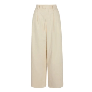 Detail view of high-waist beige wide-leg trousers with elegant front pleated design