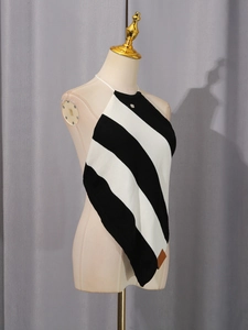 French style black and white striped halter knit top with small metal logo detail