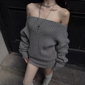 Close-up of grey off-the-shoulder cable knit dress with premium ribbed cuffs
