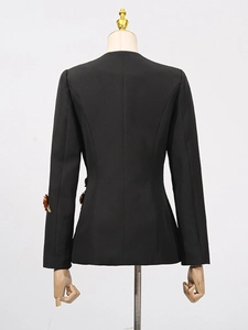 Back view of elegant black slim-fit women suit jacket with decorative floral cuff details