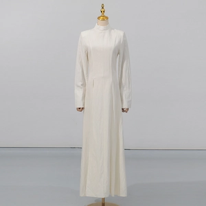 Detailed view of the fine pleated texture on this elegant white high-neck maxi dress