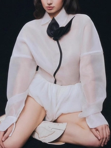 Women's white organza blouse with puff sleeves and black bow detail fashion set