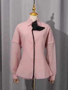 Pink lantern sleeve shirt with black floral neck detail and textured chiffon fabric