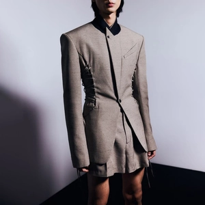 Detailed view of structured taupe fabric with metal eyelets and side drawstring lace-up