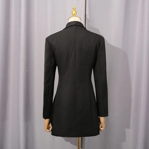 Rear view of a slim-fit black blazer with structured waist and smooth premium fabric finish