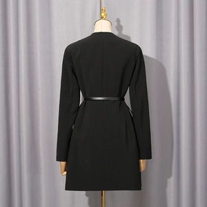 Rear view of slim fit black blazer dress with narrow waist belt on wooden mannequin