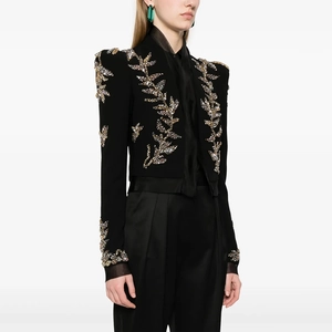 Detailed view of the luxury black cropped blazer with intricate rhinestone leaf embroidery