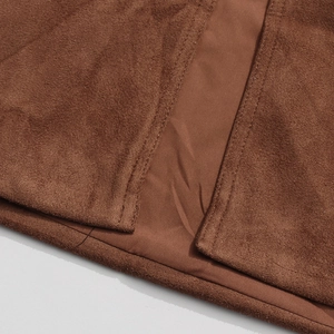 Close-up of brown faux suede fabric with reinforced double stitching and smooth inner lining