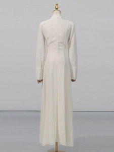 Elegant white long sleeve dress with high slit and slim fit in a back view studio shot