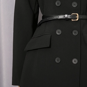 Detail shot of black double-breasted blazer coat with slim waist belt and gold buckle