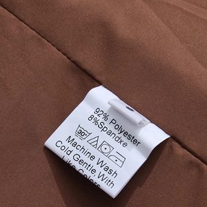Detail shot of the wash care label showing 92% polyester and 8% spandex fabric composition