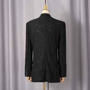 Detailed back view of a black floral lace blazer featuring a tailored fit and fabric buttons