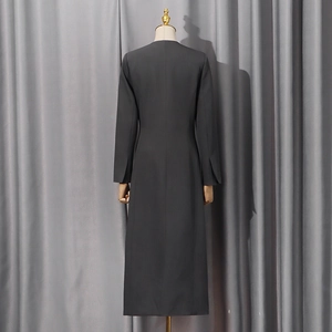 Detailed back view of charcoal grey slim coat featuring unique cuff slit design and tailoring