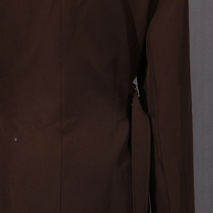 Detailed view of the dark brown blazer featuring a side metal buckle and precise stitching