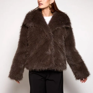 Detail shot of plush dark brown faux fur texture and elegant wide lapel collar jacket