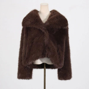 Detailed view of deep brown faux fur jacket showing plush texture and wide lapel collar