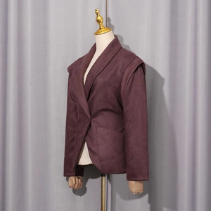 Detail view of burgundy suede texture on women's slim-fit jacket with notched lapel