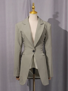 Slim-fit olive green blazer for women featuring unique lace-up waist details and padded shoulders