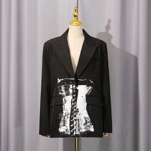 Detail of black blazer featuring white artistic hand-drawn corset print and flap pockets