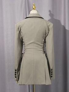 Back view of a khaki slim-fit blazer with lace-up eyelets and pleated hem for women