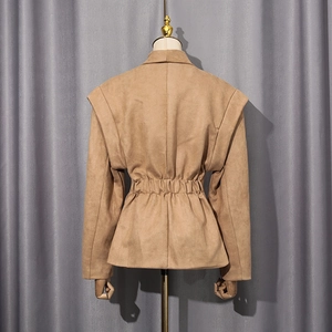 Detail view of khaki faux suede jacket showing waist-cinching back pleats and silhouette