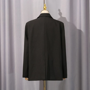 Rear view of black slim fit blazer showing central back vent and straight silhouette