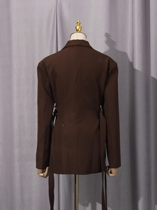 Elegant deep brown long-sleeved blazer with irregular back streamers for a modern office look