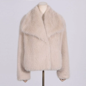 Detail of beige faux fur coat featuring soft texture and stylish wide lapel collar
