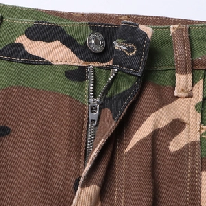 Macro shot of metal button and zipper on camouflage mini skirt with belt loops