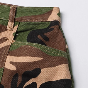 Detail of street style camo skirt showing twill fabric texture and side pocket design