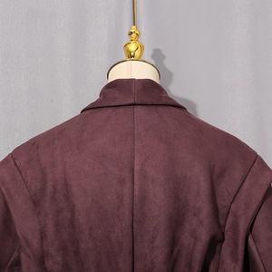 Close-up of the deep purple faux suede jacket back showing collar and shoulder stitching