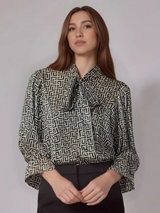 Women's long sleeve blouse featuring black and white Greek key pattern with a bow neck