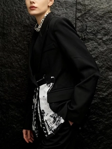 Slim fit black blazer with unique white abstract print and metal chain accent detail