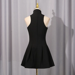 Rear view of black sleeveless high-neck pleated dress showing slim fit cut and texture