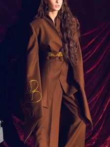 Elegant brown women's blazer suit with yellow embroidery and long silhouette sleeves