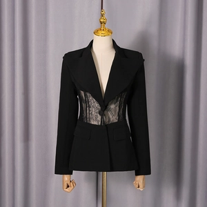 Detail of a slim-fit black blazer featuring elegant lace patchwork and sheer waist panels