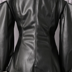 Detail view of the tailored back structure and visible stitching on black leather blazer
