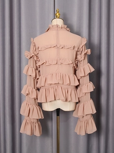 Elegant apricot ruffle blouse for women with layered cascading ruffles and long sleeves