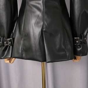 Detail of faux leather blazer featuring silver metal buckles on cuffs and back slit design